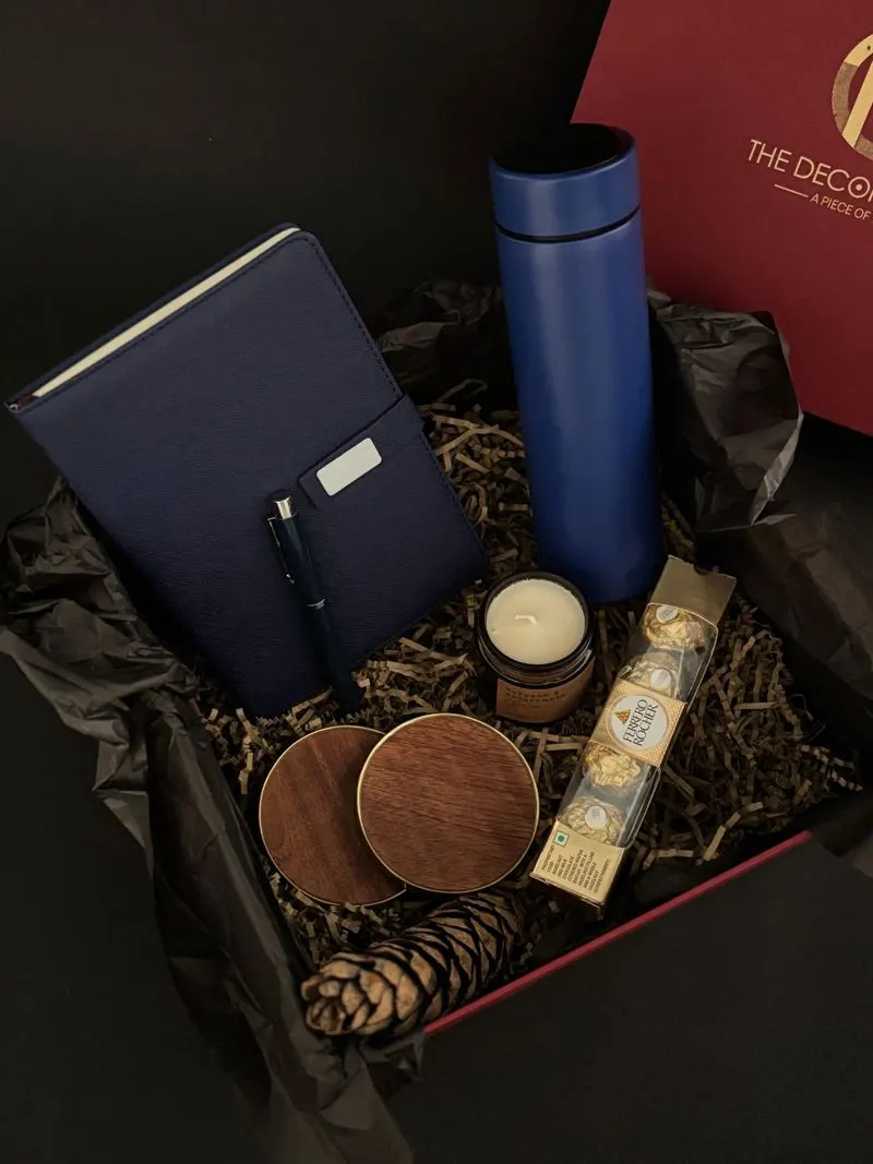 Curated gift basket with notebook, flask and chocolates